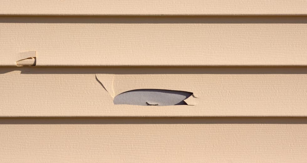 How to Fix a Hole in Vinyl Siding Roof Right