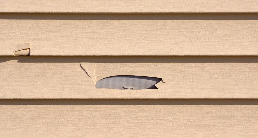 How to Fix a Hole in Vinyl Siding 