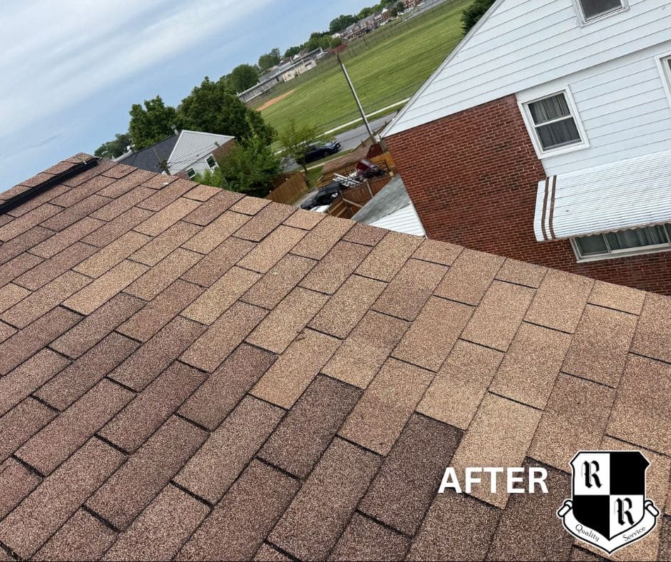 On a red shingled roof, a white vent boot is installed with a hammer, pry bar, and pliers nearby; worker's shoes visible at bottom.