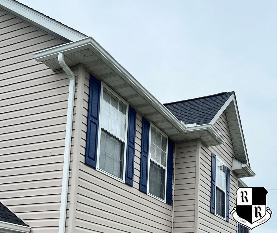 This is an image of a seamless gutter replacement by Roof Right in Westminster, Maryland featuring white, K-Style gutters and downspouts.